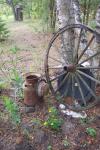 Rusty Milk Can And Wagon Wheel