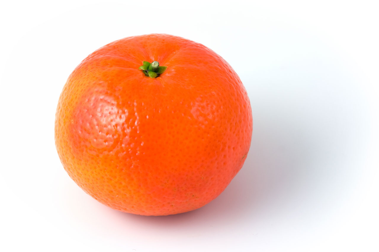 A single clementine on white background