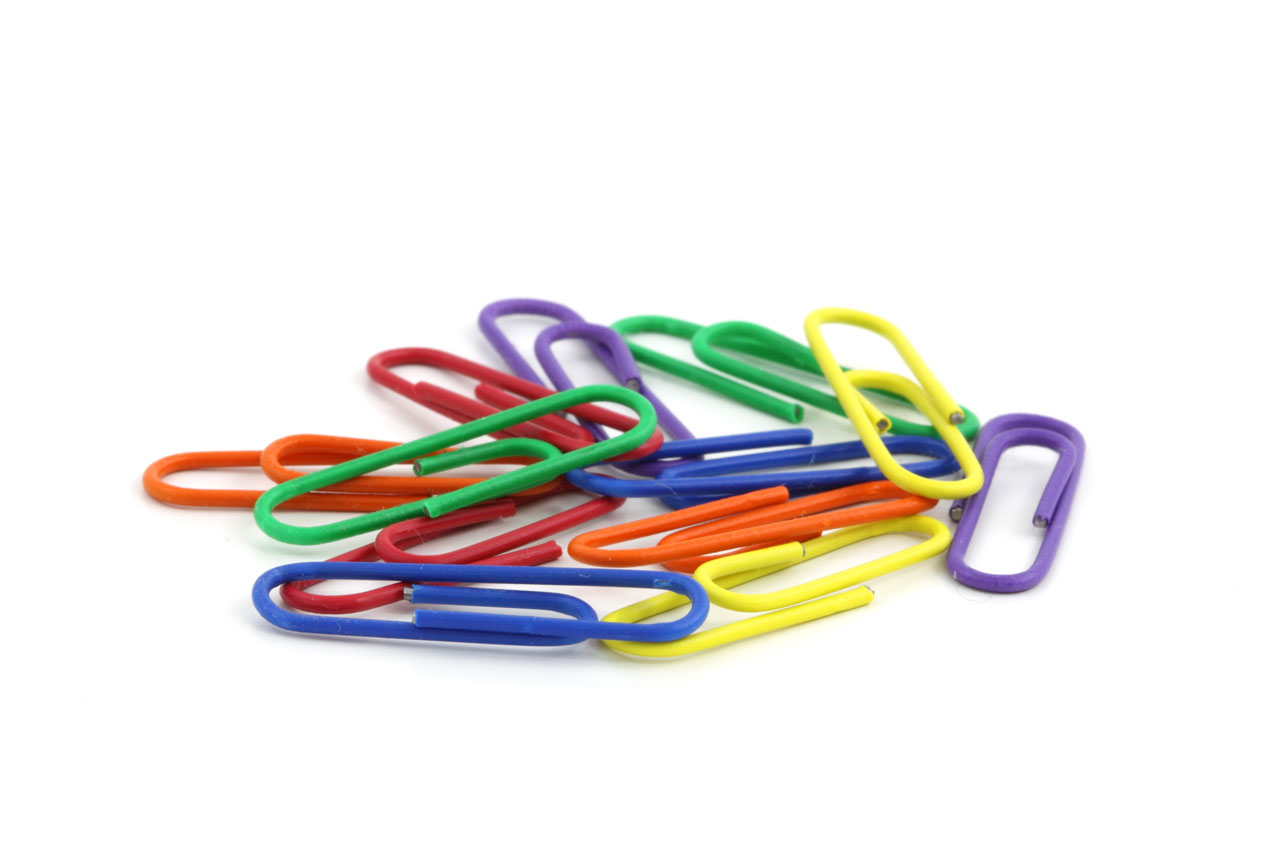 Several paper clips on white background