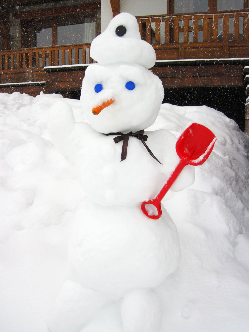 cute small snowman covered with snow
