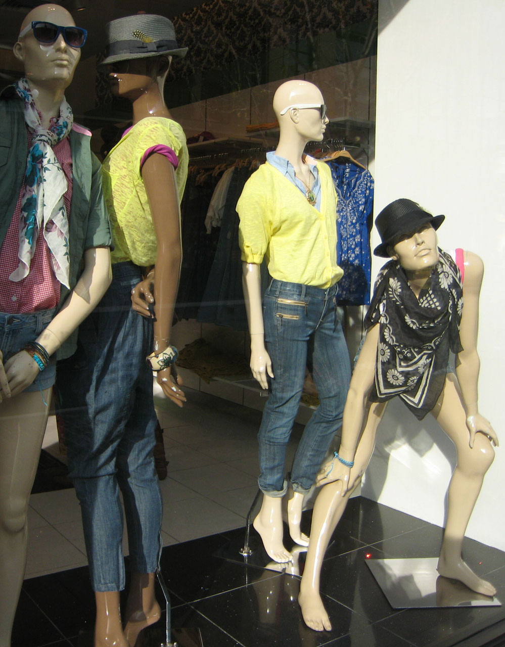 Display window with uniquely posed mannequins