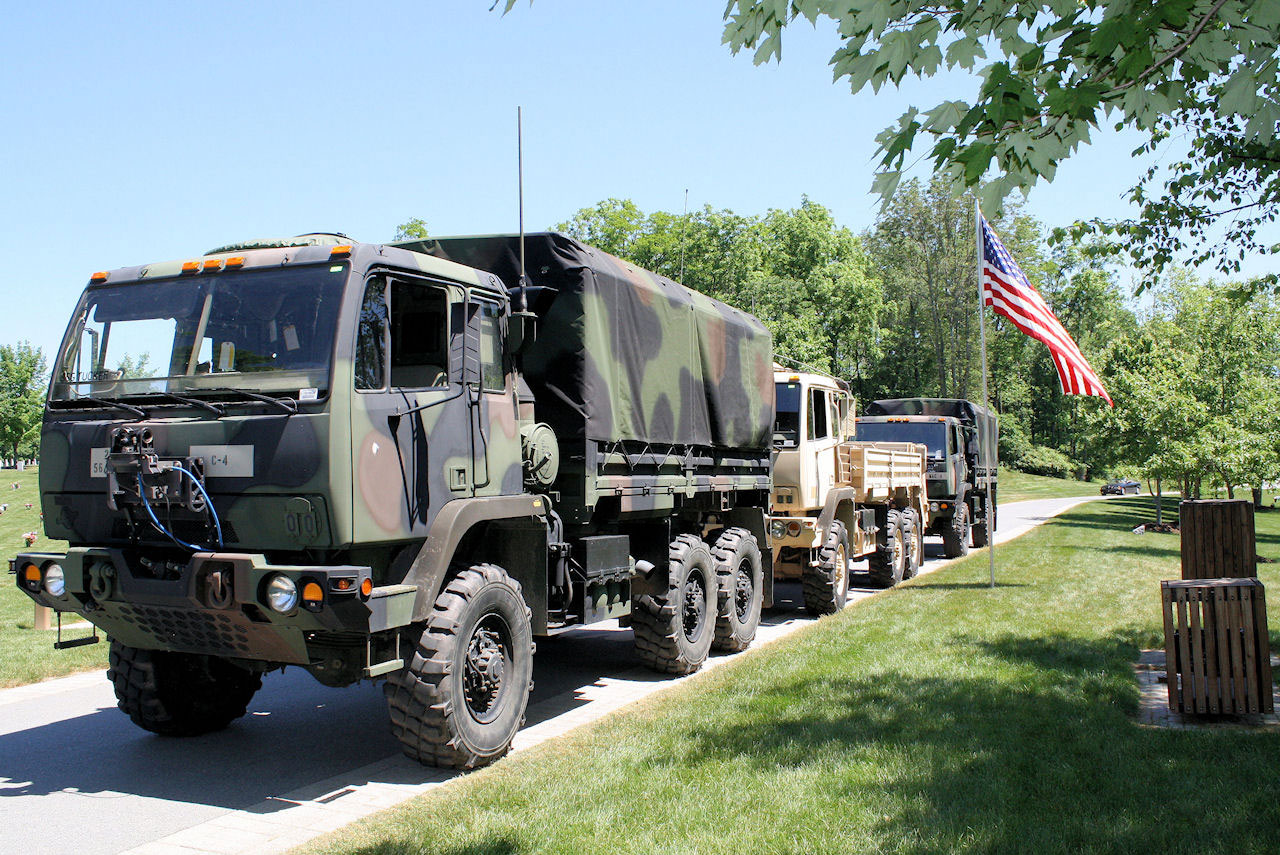 Picture taken at Fort Indiantown Gap National Cemetery of the Reserve vehicles parked along curb