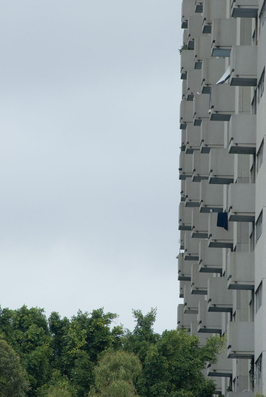A grim looking urban scene, balconies on a block of flats