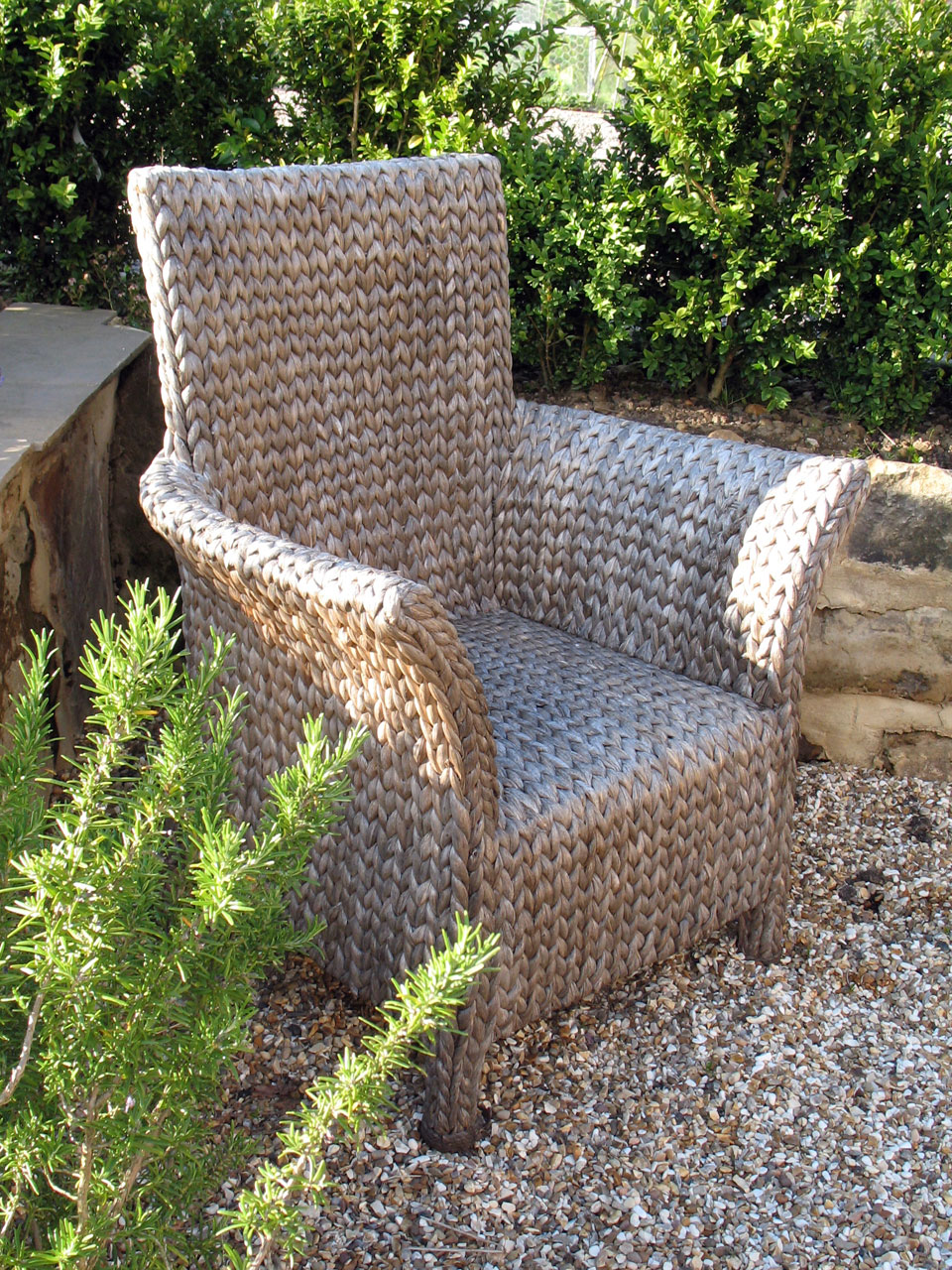 A basket chair on the garden