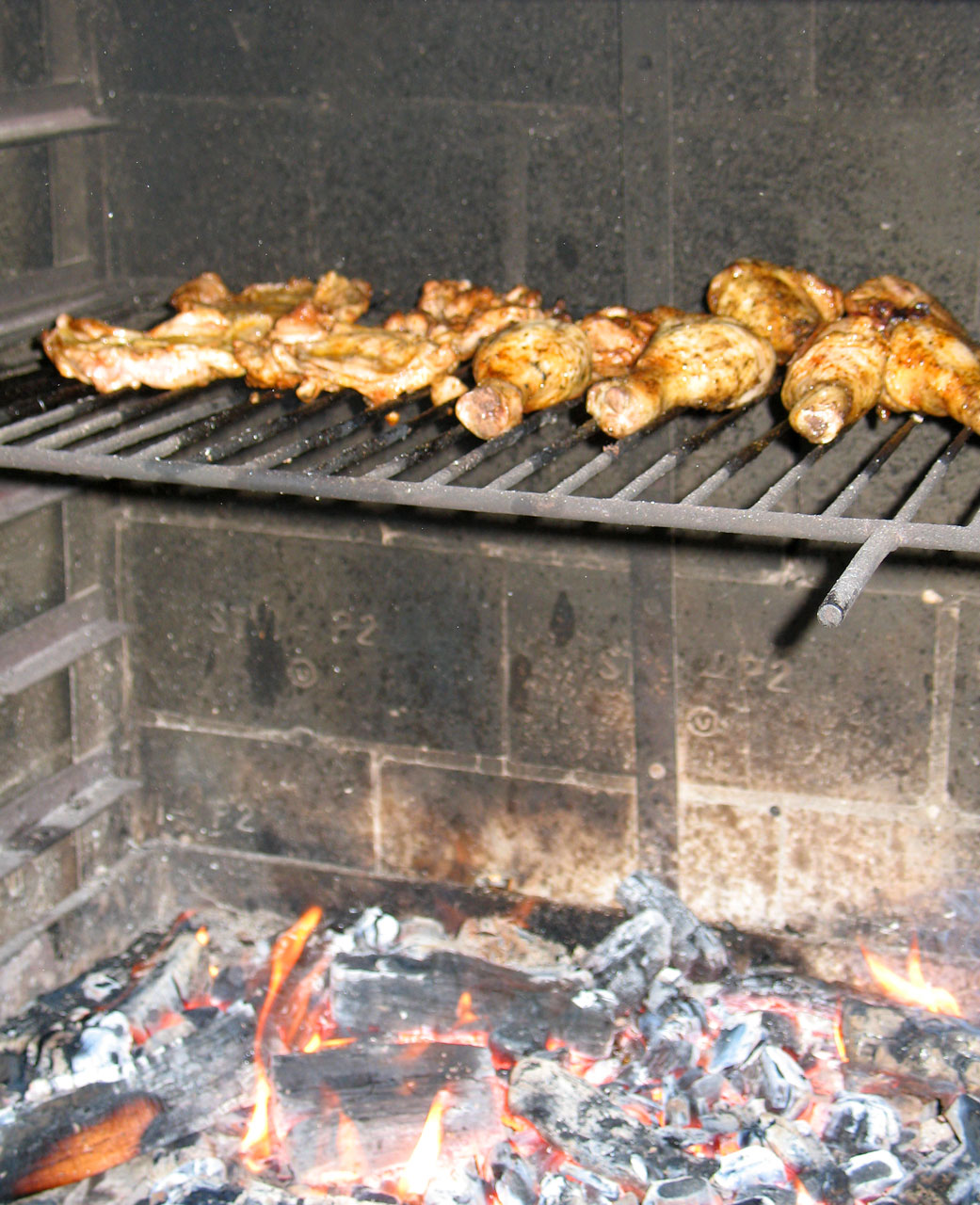 Delicious roasted chicken above the fire