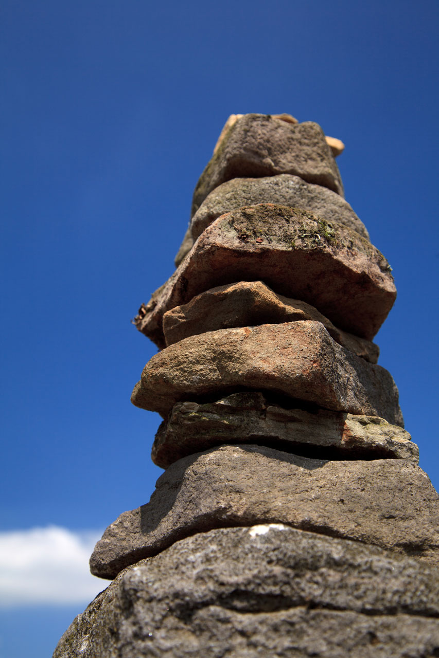 balancing rocks against blue sky