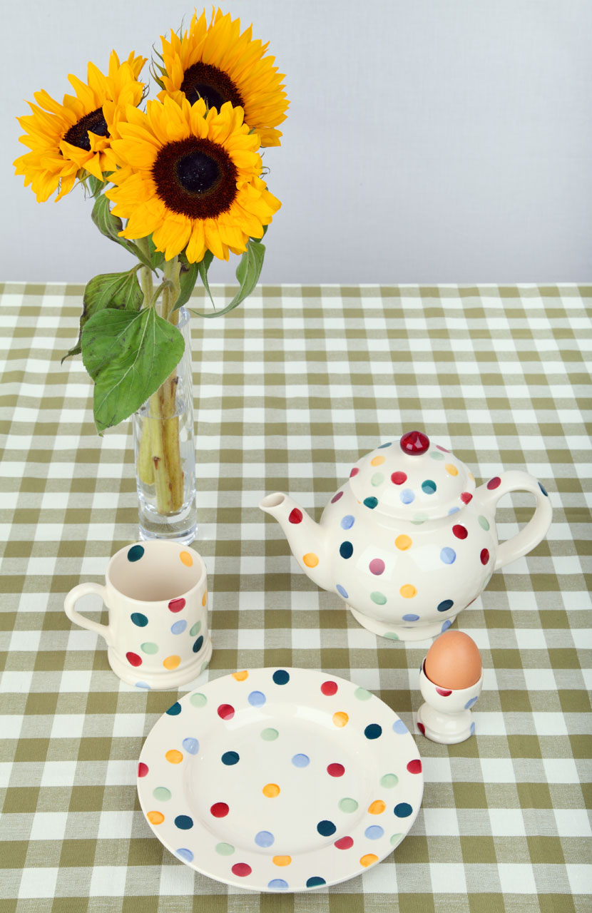 getting ready for breakfast with sunflowers and polka dots dishes