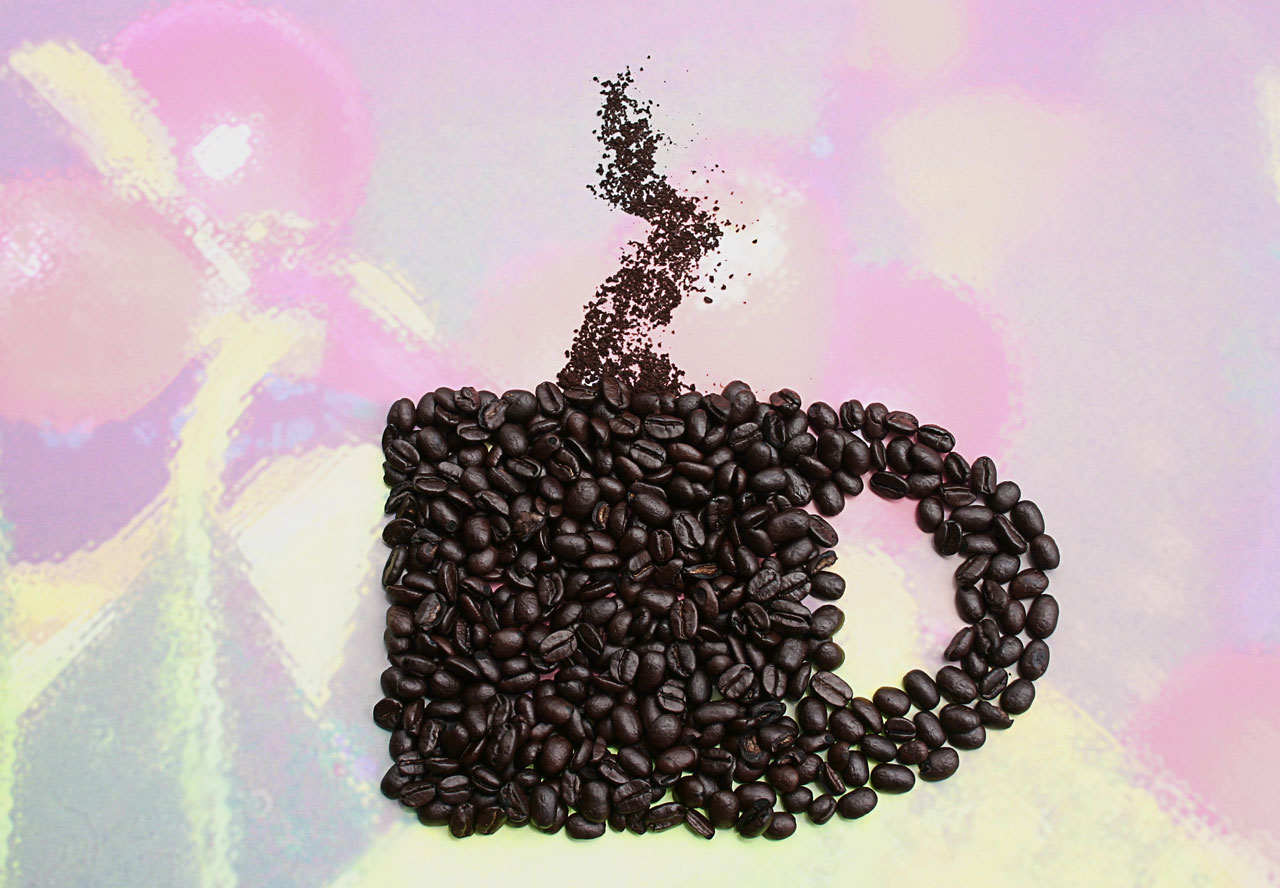 coffee beans arranged in shape of mug