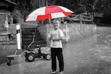 Little Boy With Red Umbrella