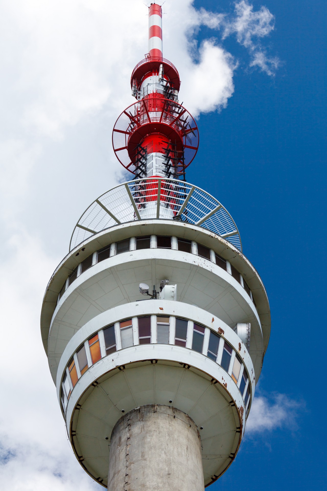 A detail of a broadcasting TV tower with sky in the background