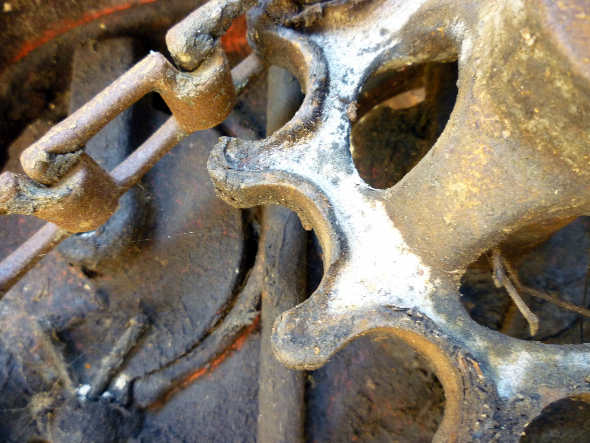 Rusty metal cog on farm machinery