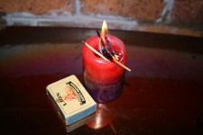 Burning Candle And Matchbox