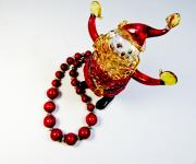 Santa Figurine And Red Necklace