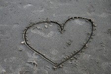 Single Heart Drawn In Sand