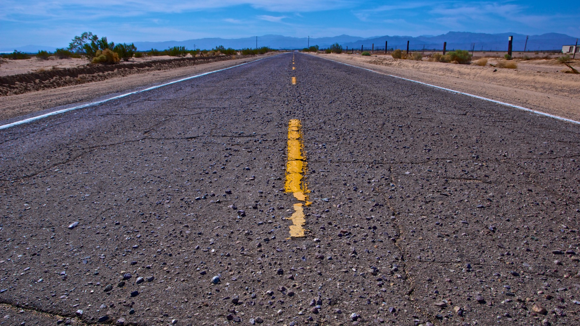 Abandoned open road in Mojave Desert.
