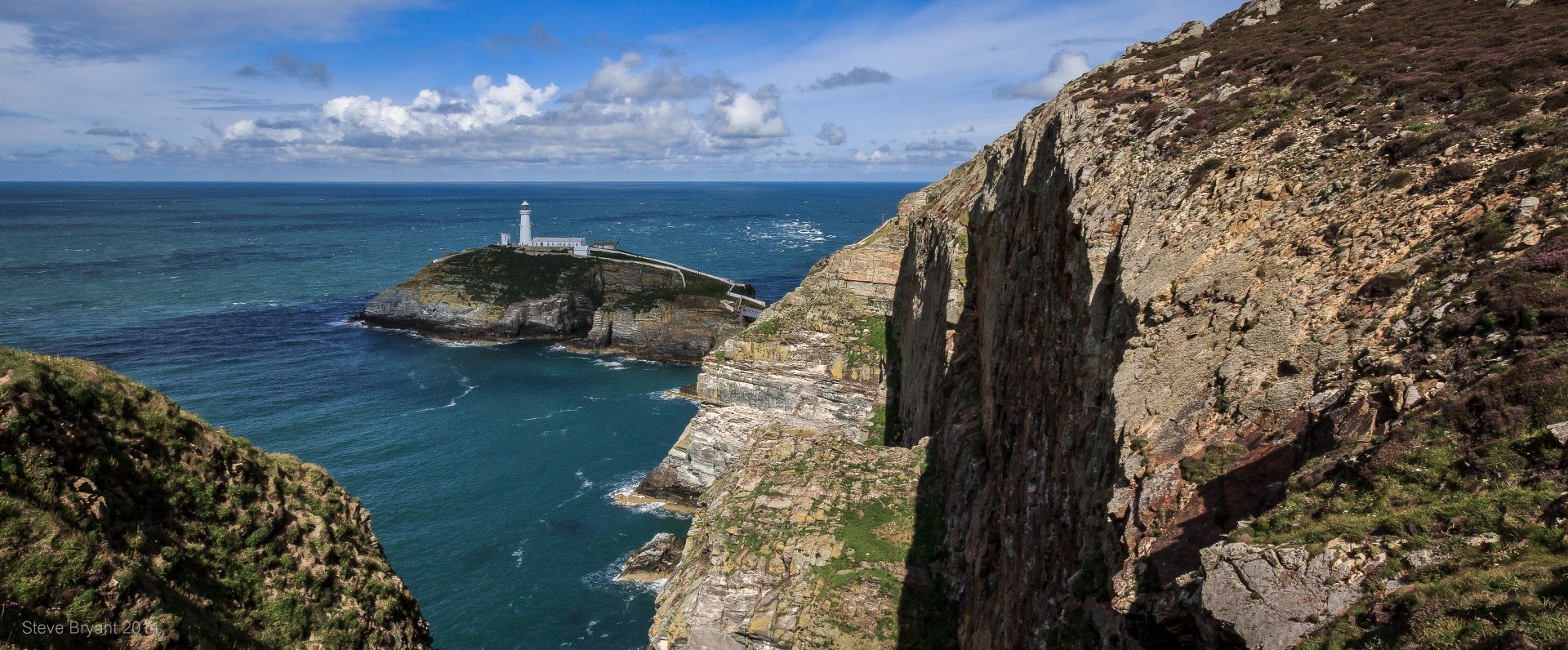 South Stack Lighthouse on the coast of Anglesey Wales .