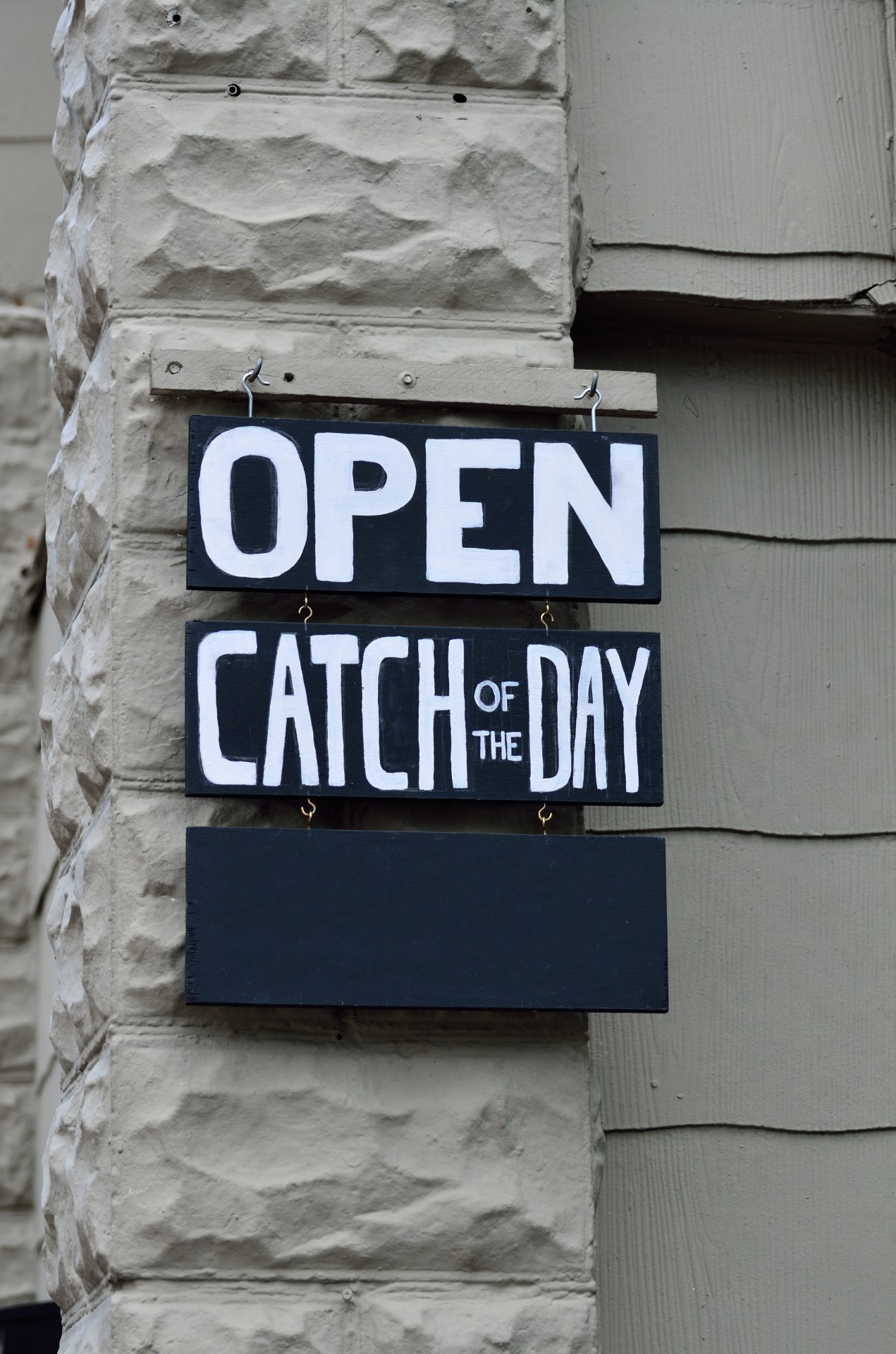 Open sign catch of day at restaurant