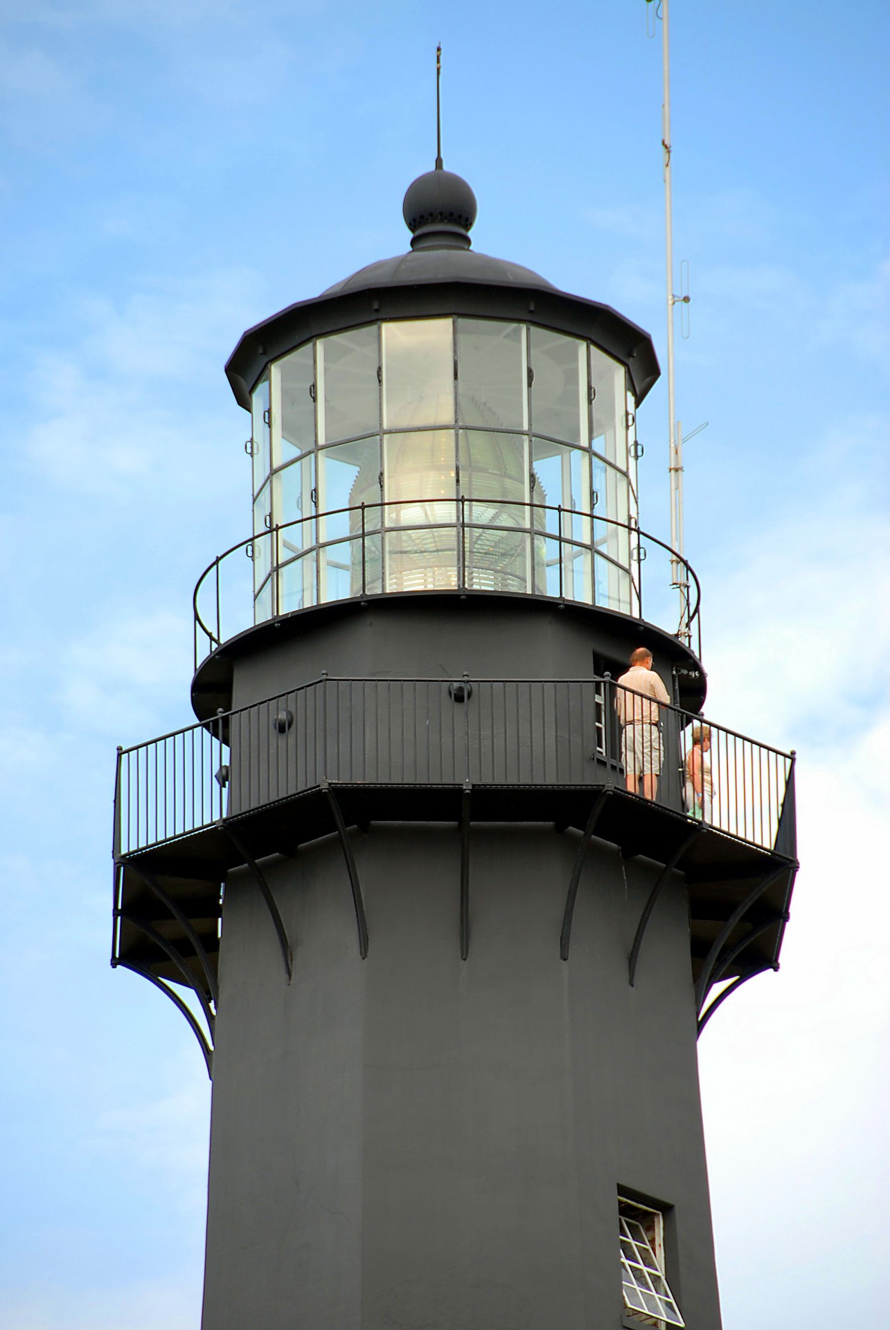 People On Top Of Lighthouse