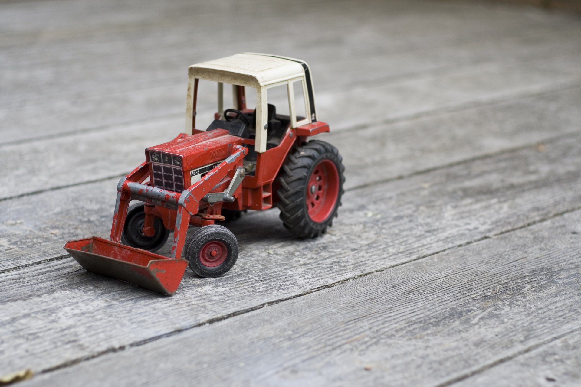 Toy Tractor On Decking
