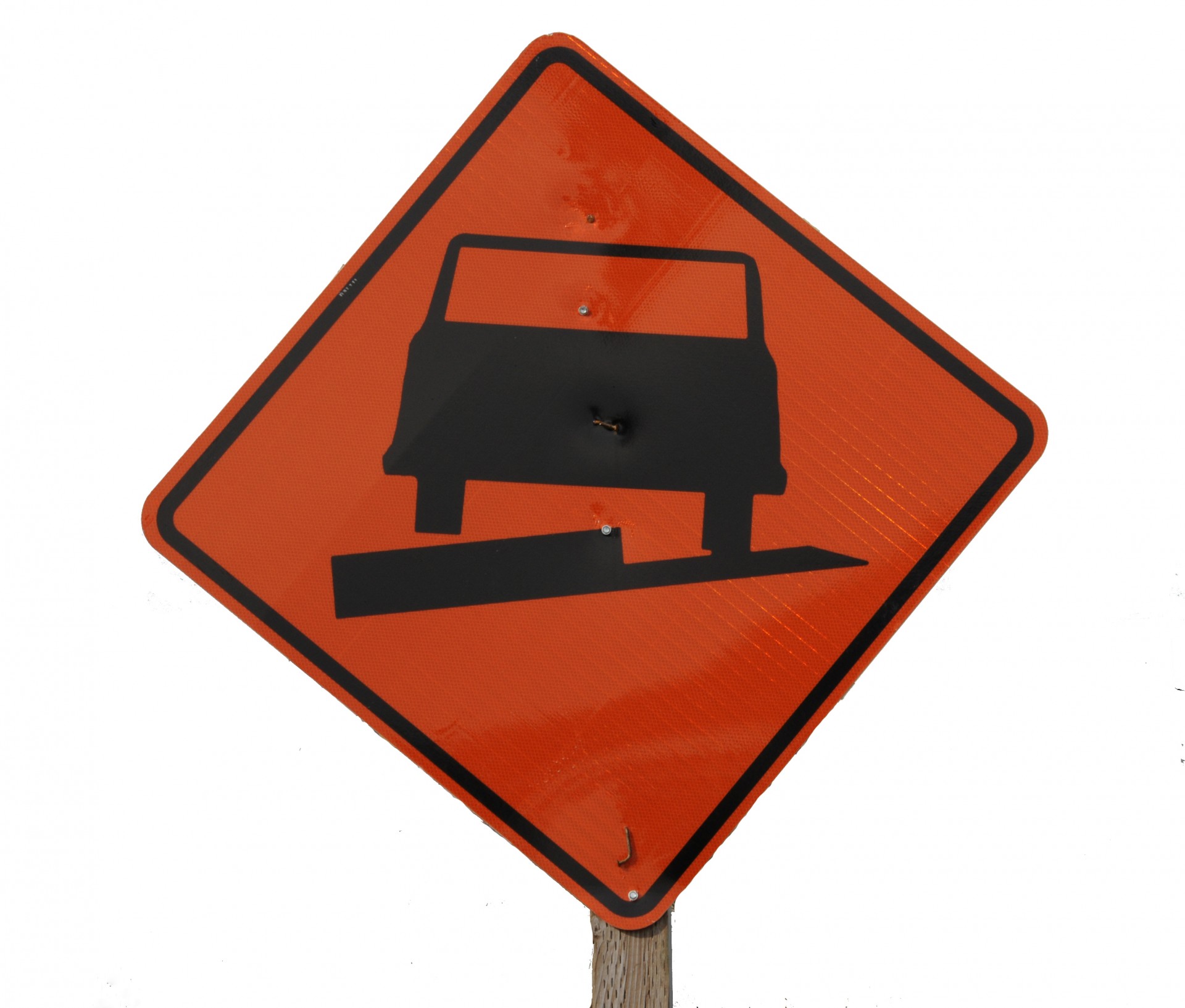 Orange sign with a tilted car displayed to warn drivers of uneven pavement