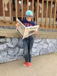 Boy Reading Newspaper