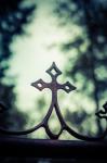 Rusted Metal Cross In Cemetery