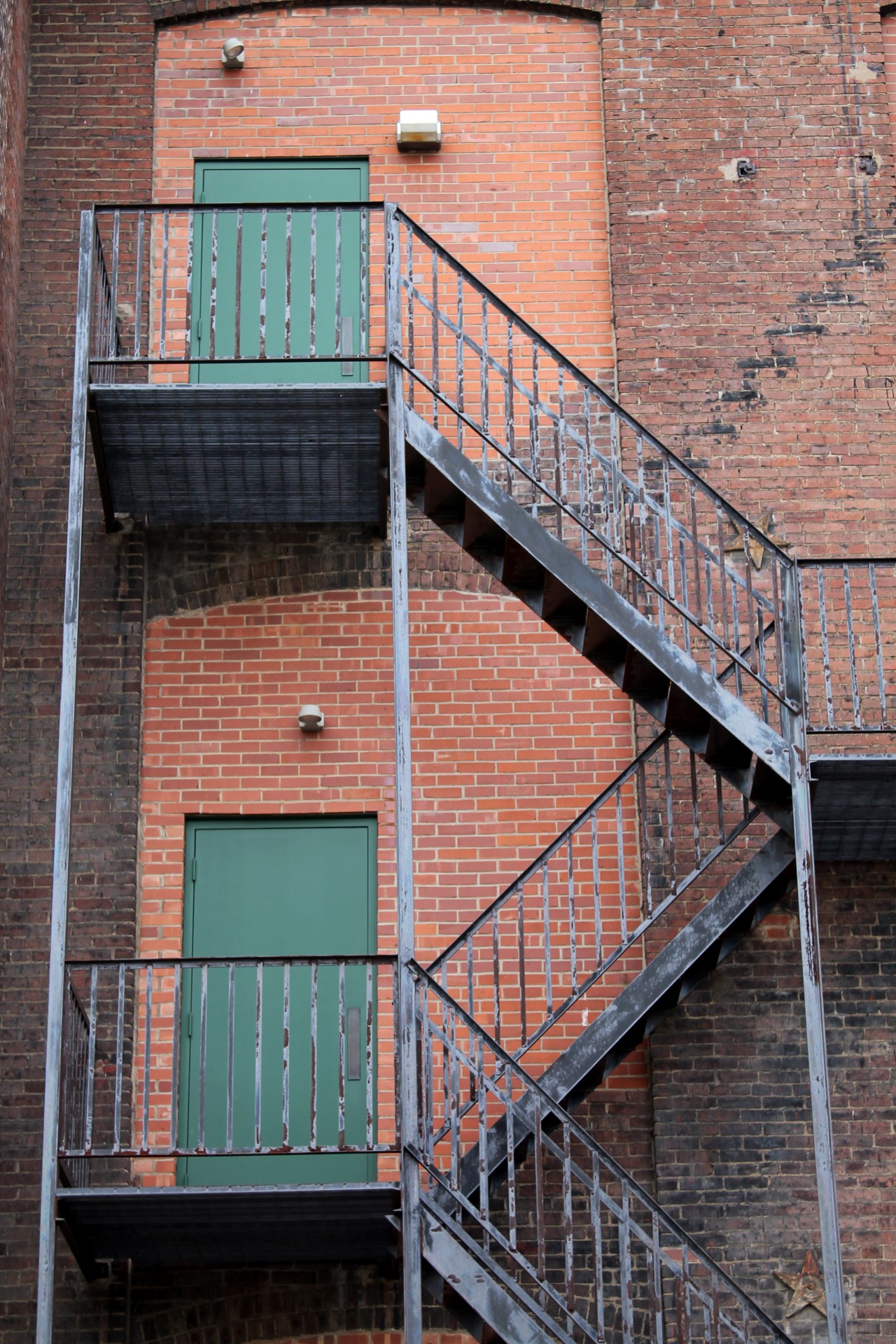 Fire escape on the side of an old brick building - I really appreciate your premium download!