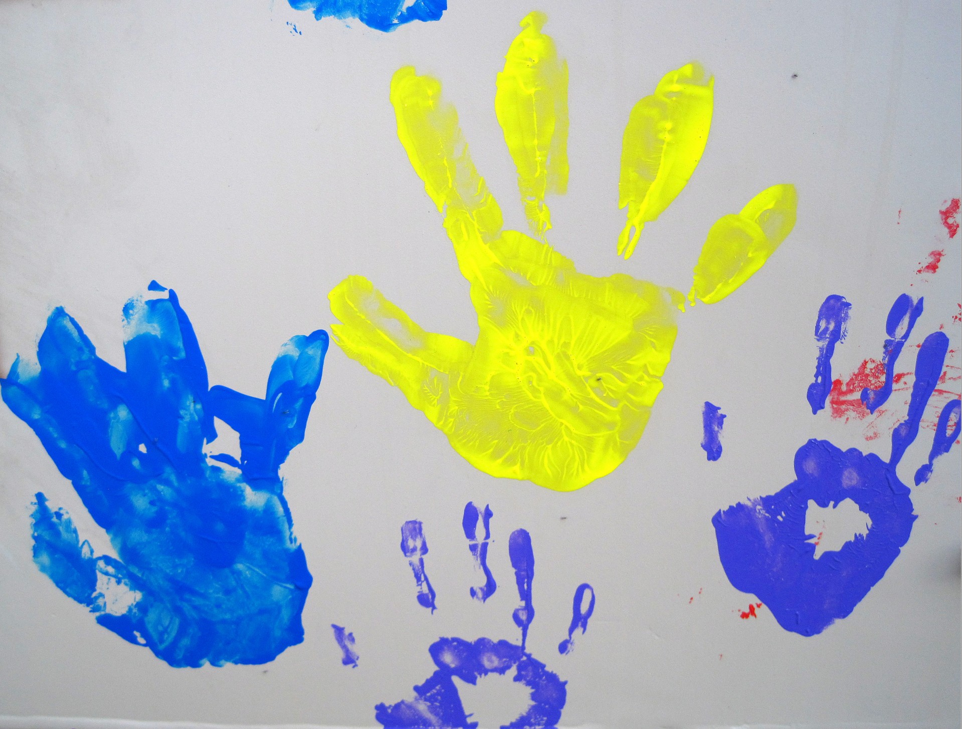 Paint-printed Hands Of Children