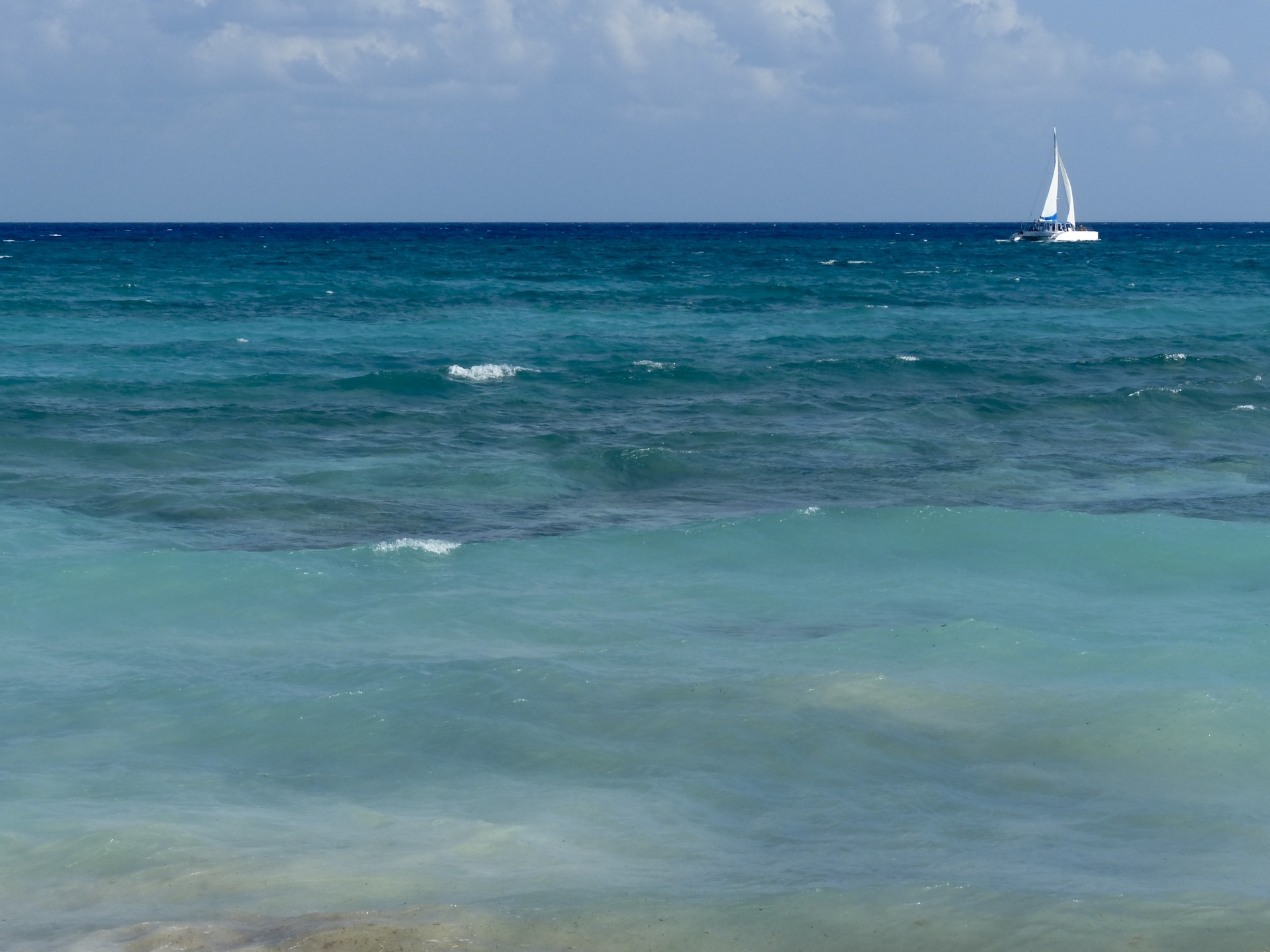 Sailboat On Turquoise Sea