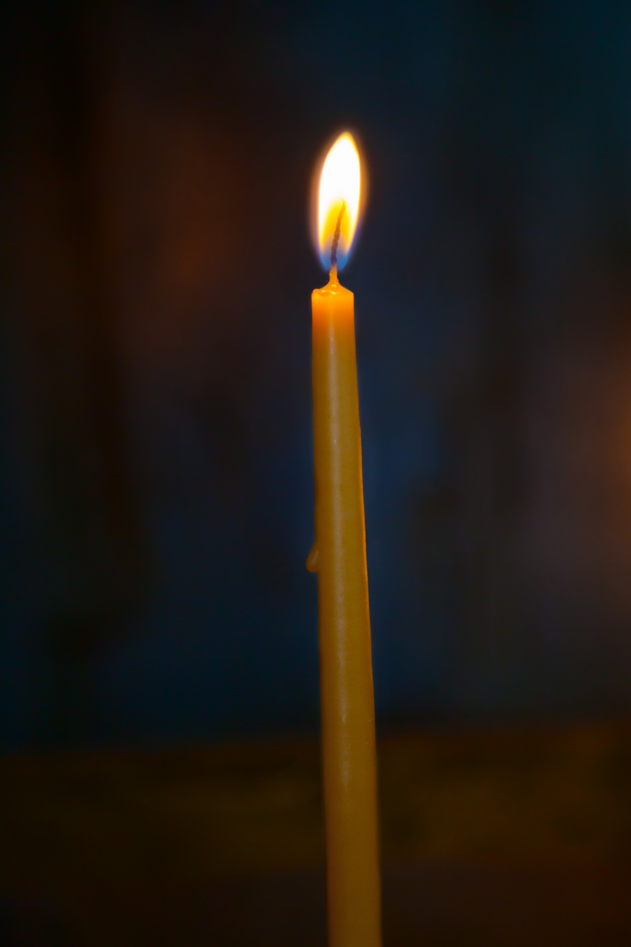 Thin church candle burning