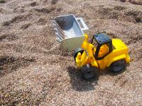 Digger Toy In The Sand