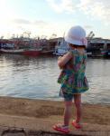 Girl Looking At Fishing Boats