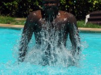 Man Splashing In The Pool