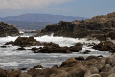 Ocean Waves Crashing On Rocky Shore