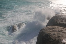 Wave Burst On Rocks