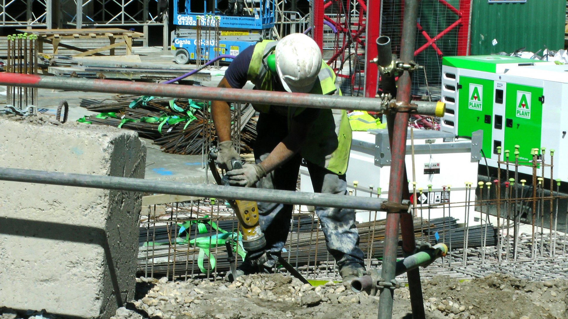 Construction Site Worker With Pneumatic Drill