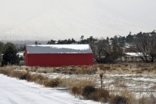 Red Barn In Snowy Landscape