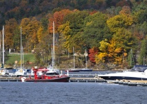 Red Sailboat In Autumn Harbor
