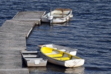 Small Boats Tied To Pier