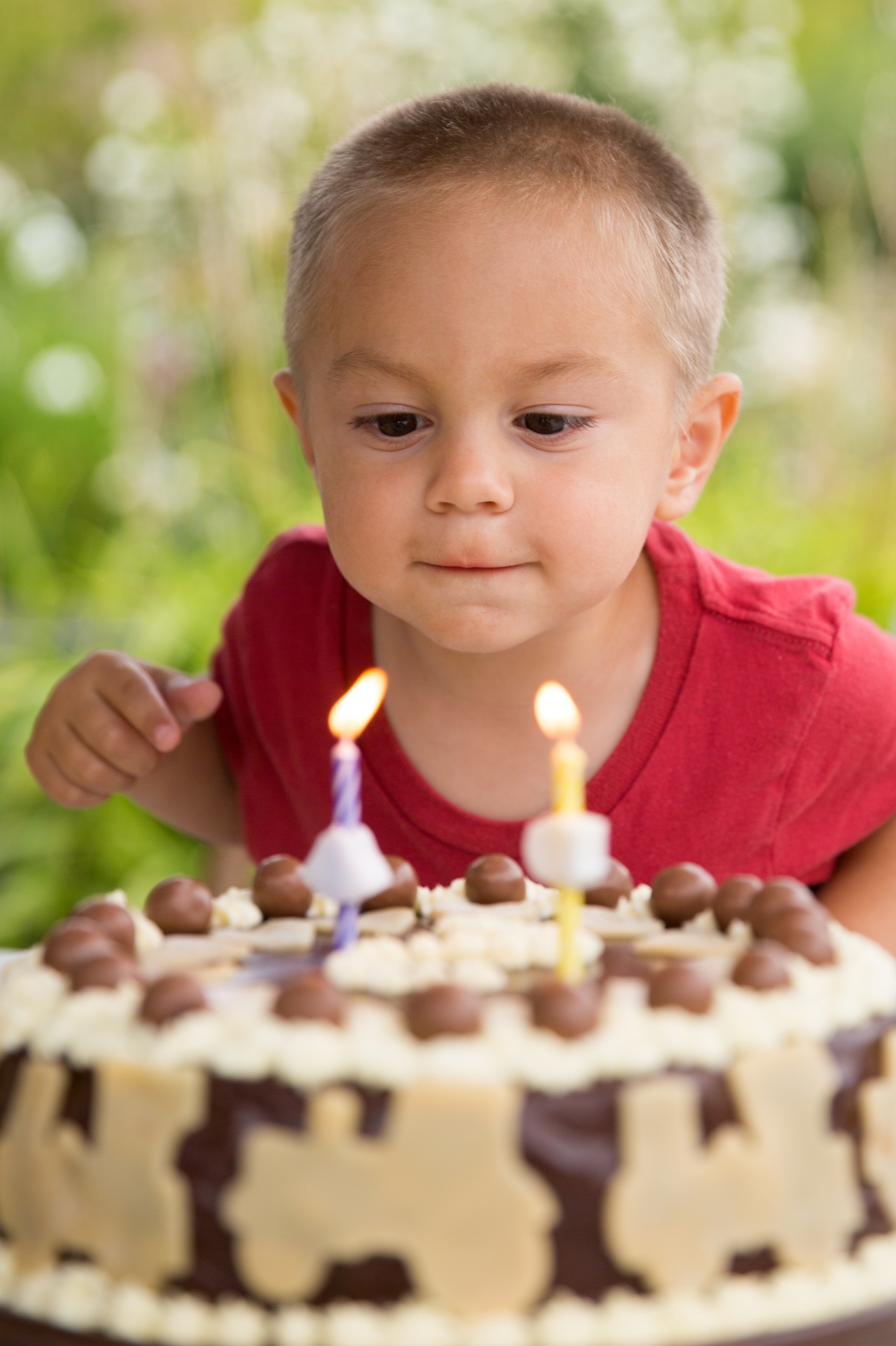 Boy Blowing Out Candles