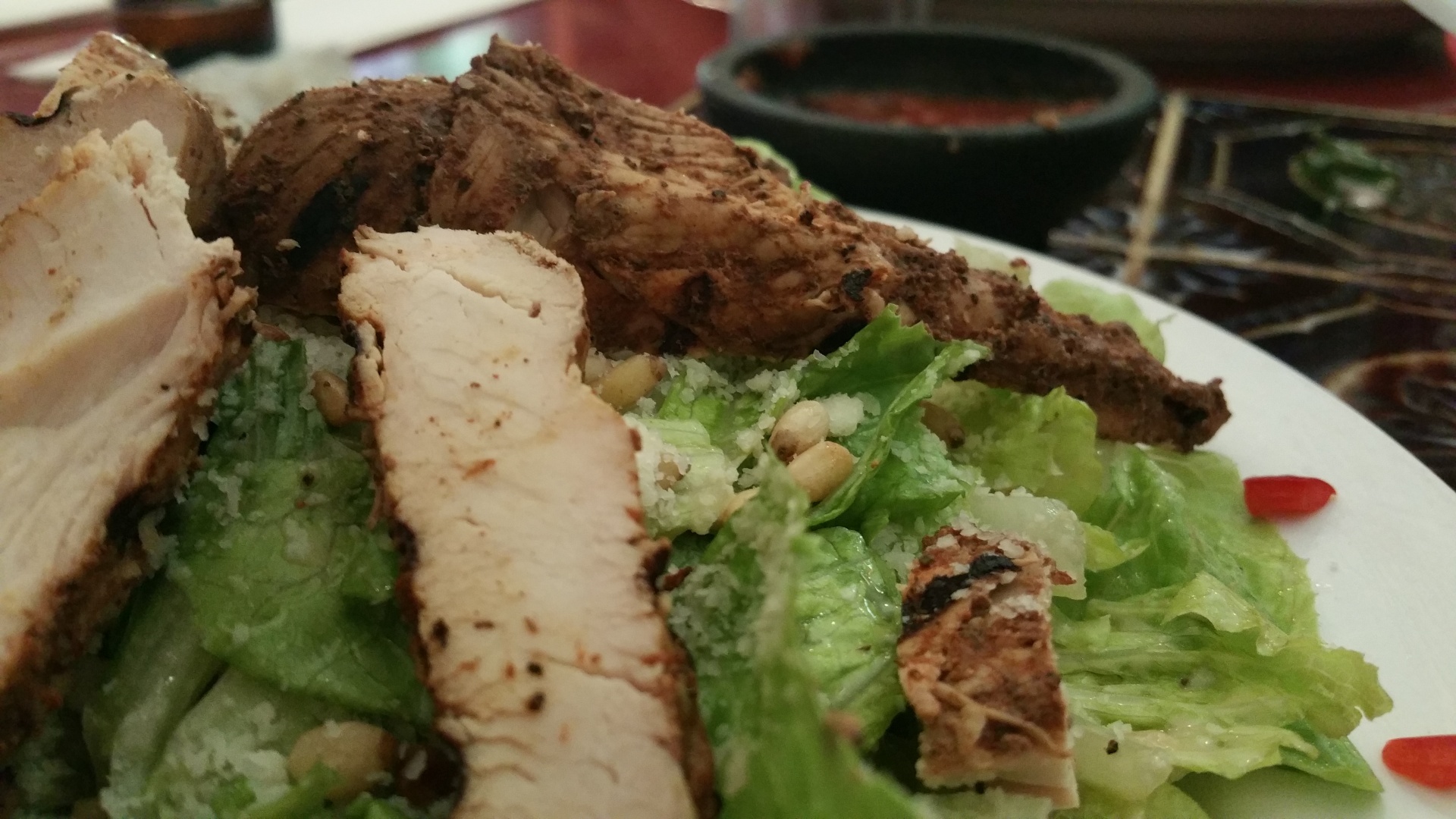Chicken, lettuce and caesar dressing served at a restaurant