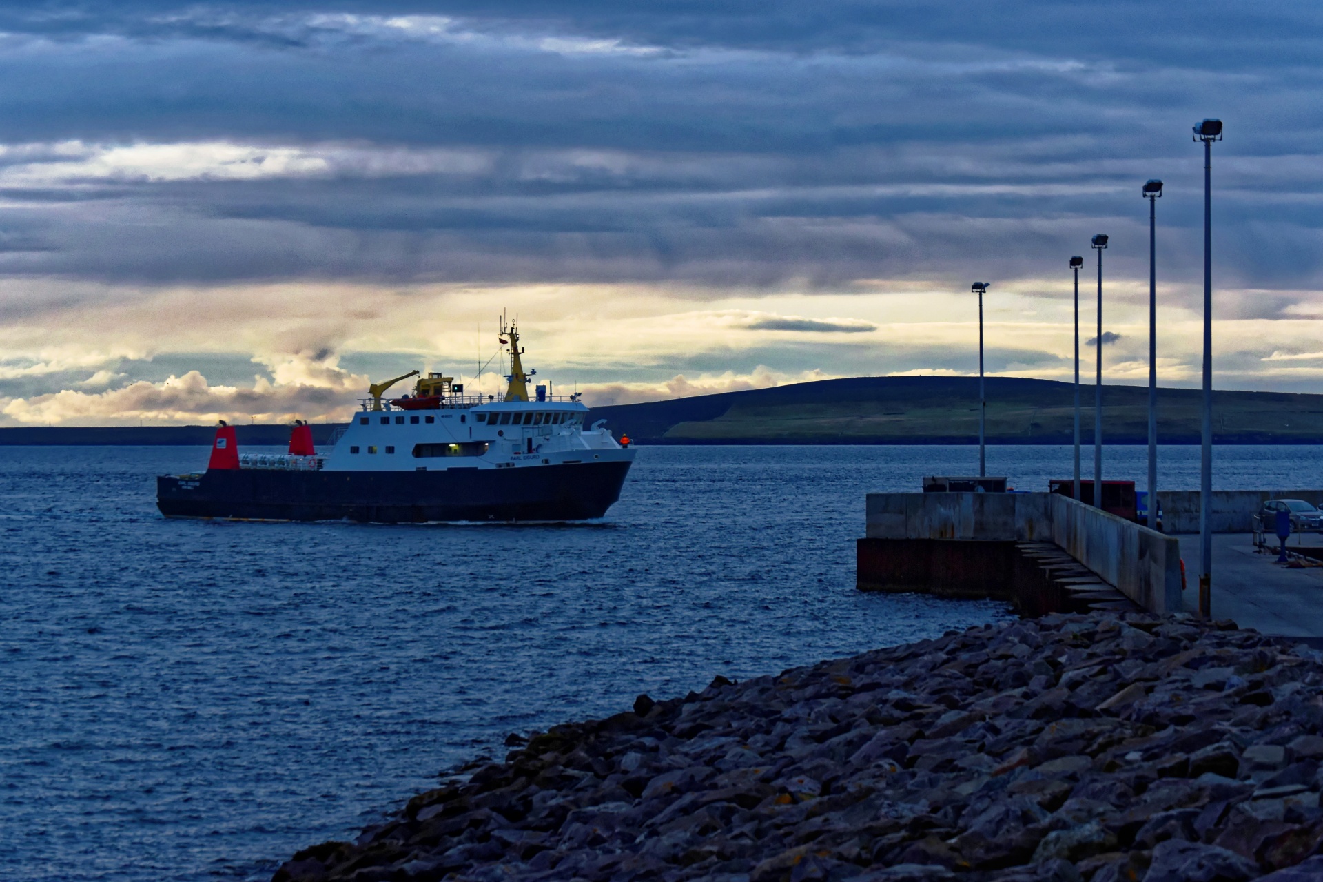 Ferry coming in to port at dusk with the light fading