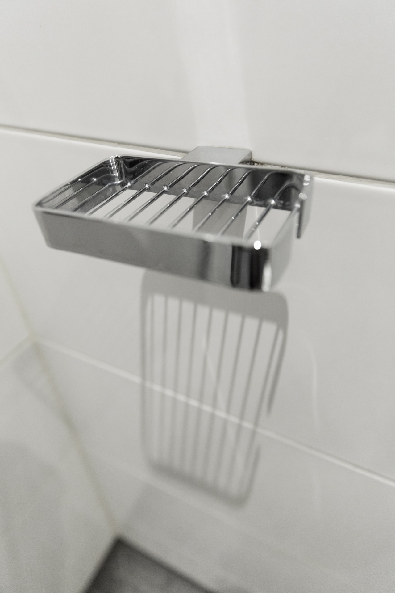 Stainless steel soap holder in a bathroom