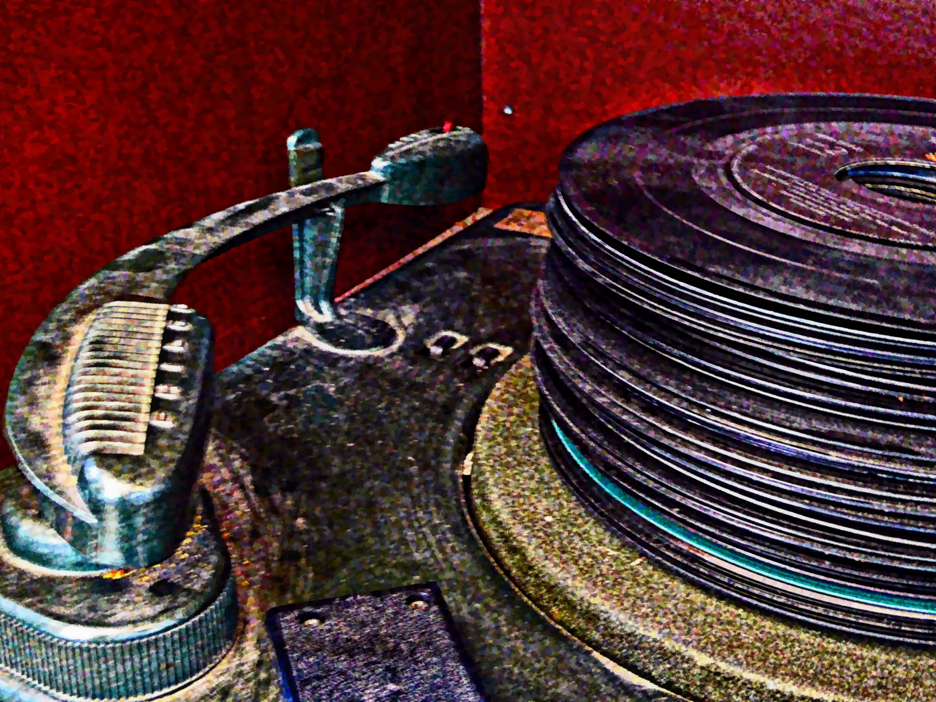 artistic effect applied to photo of a pile of 45 RPM records next to dusty turntable arm
