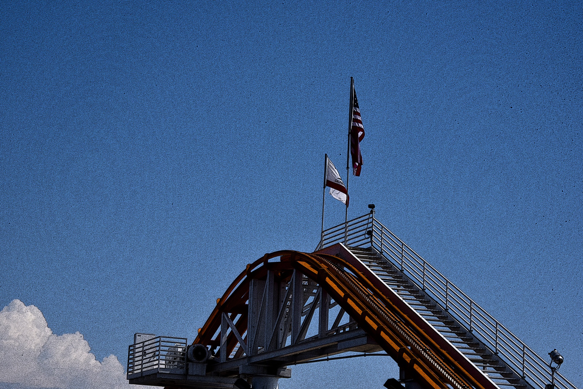Flags at the top of a roller coaster