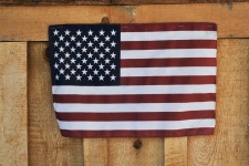 American Flag On Wooden Fence