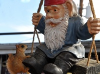 Gnome And Squirrel On Swing
