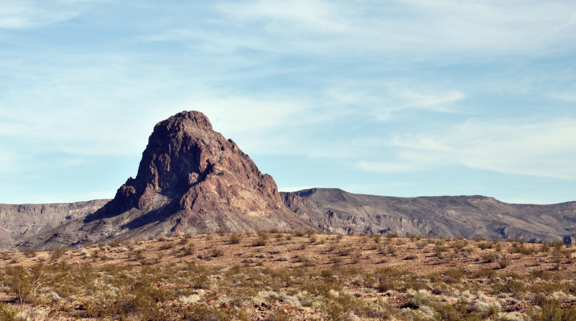Desert Landscape of a Large rock protruding from the Arizona Desert