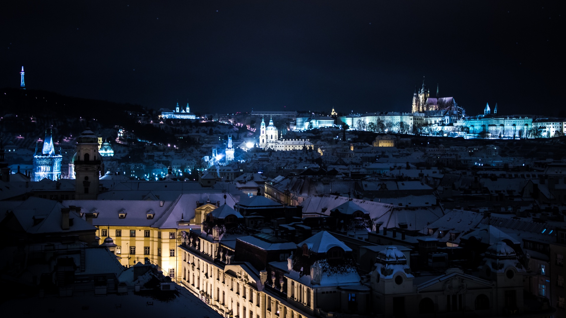 Night snowy Prague, view from the Old Town Hall tower