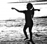 Silhouette Of Child At Beach